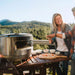 man and woman laughing over pizza with the pizza oven in front of them and 5 ingredient dish